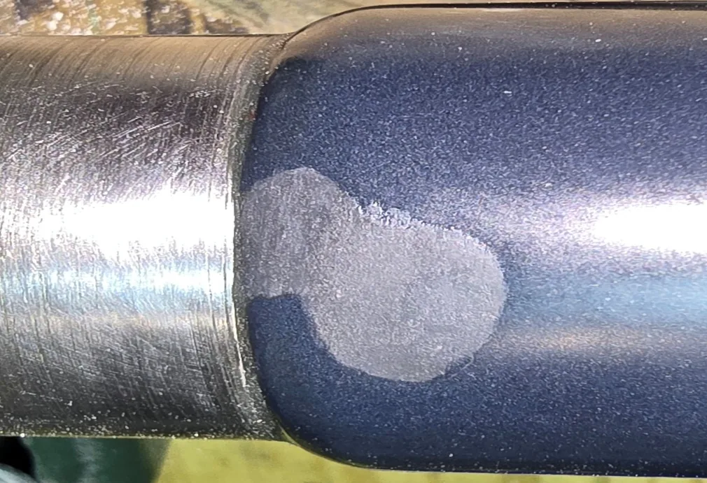 Repair material applied to rebuild and blend the production contact surface